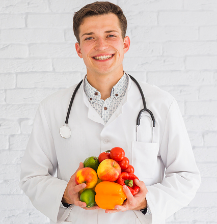 young-male-doctor-standing-against-wall-holding-healthy-food 1